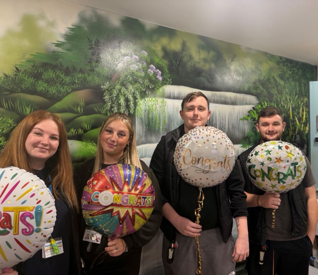 Holly Cooper celebrating with colleagues at Cygnet Manor